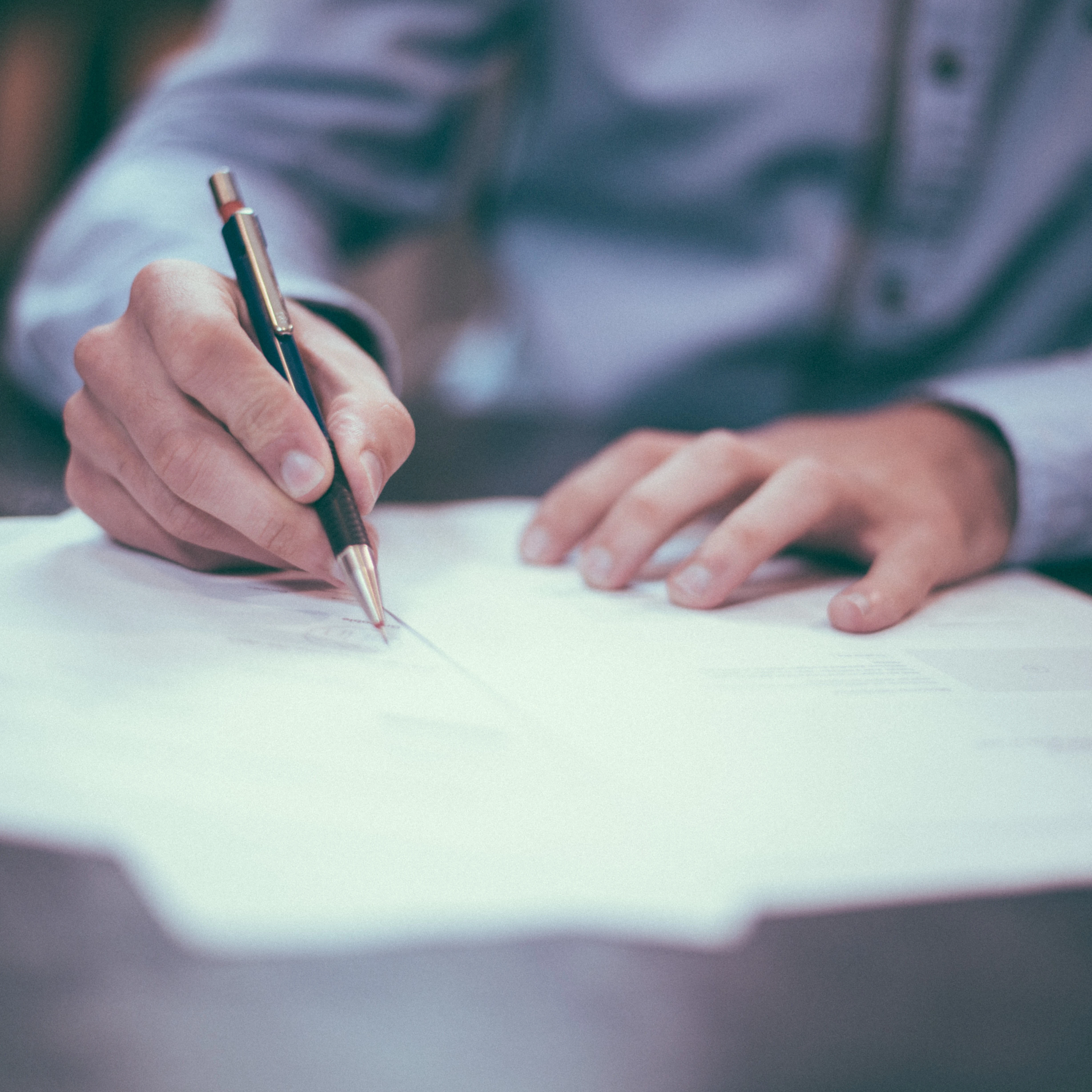 Man filling in procurement documents