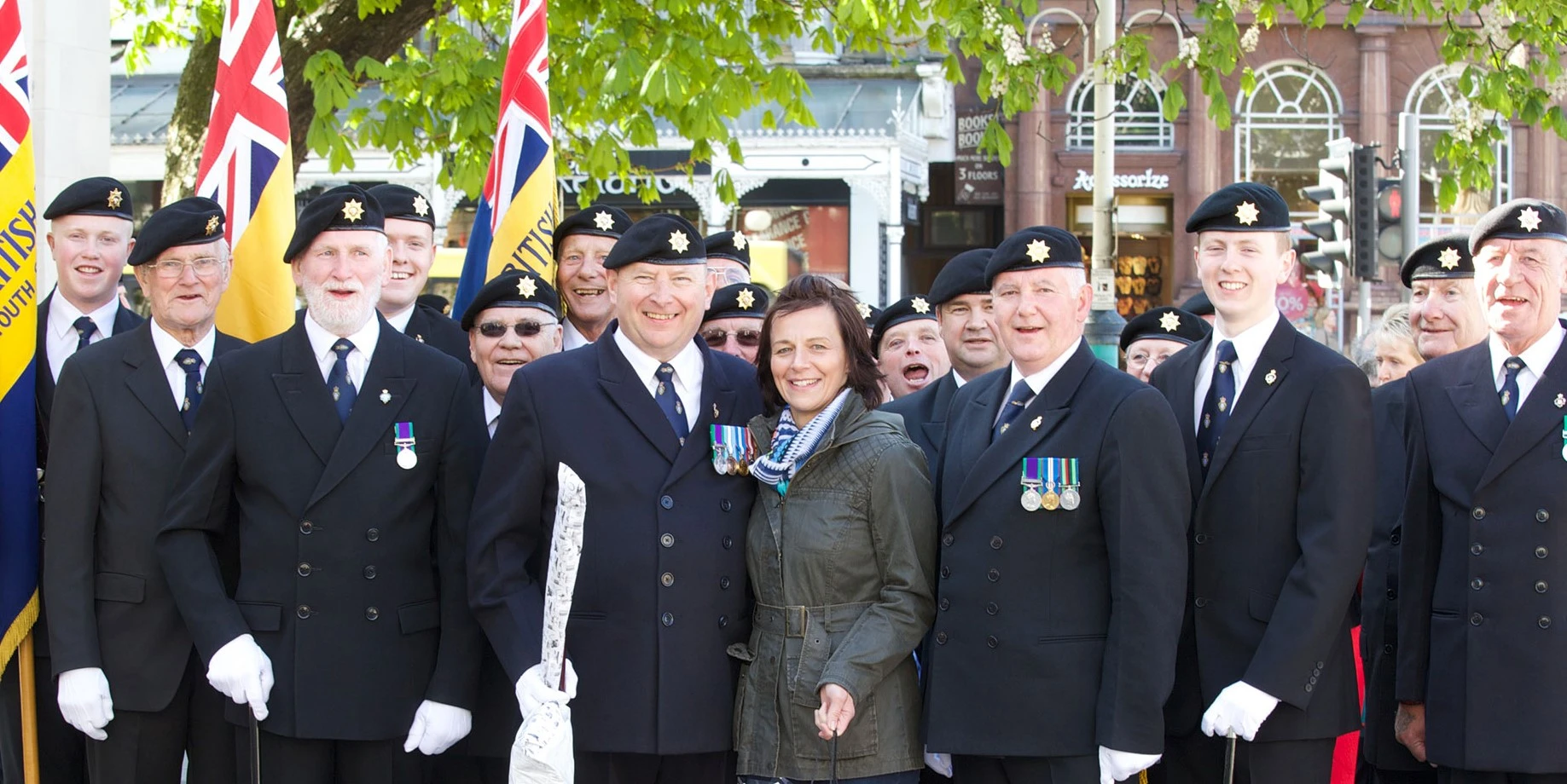 Members of local branch pose wearing medals